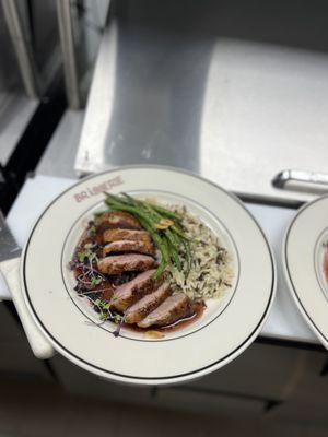 Pan seared duck with cassis reduction