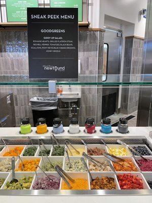 Salad Bar Topping Section - Colorful Hydroflasks are used to store the sauces/dressings