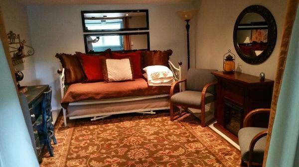 Day bed in living room that sleeps 2. Lower bed slides out.