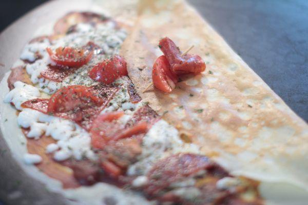 Pizza Crepe: Melted Cheese, Pepperoni, Tomatoes, Mushrooms, Oregano, Italian Sauce
