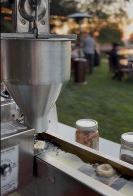 Always bringing hot and fresh mini donuts to your event with our lil orbits mini donut machine!
