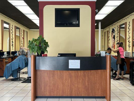 From the waiting area.  Usually two barbers working at any one time.