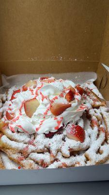 Funnel cake with strawberries and homemade whipped cream