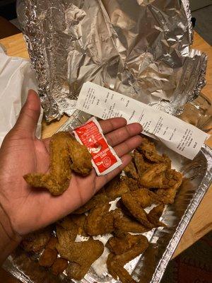 20pc wings/ compared to a ketchup packet.