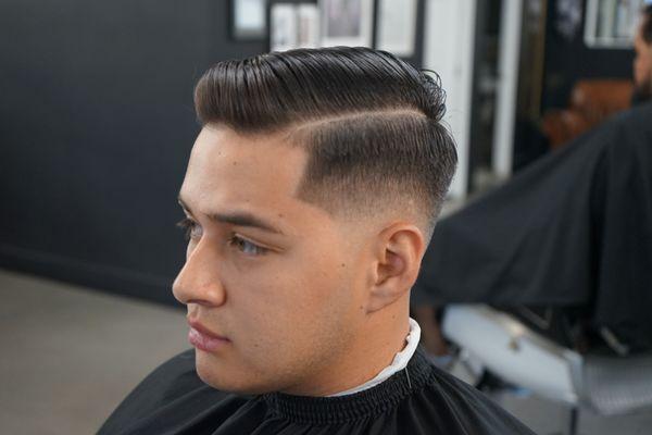 Mid fade with a natural part