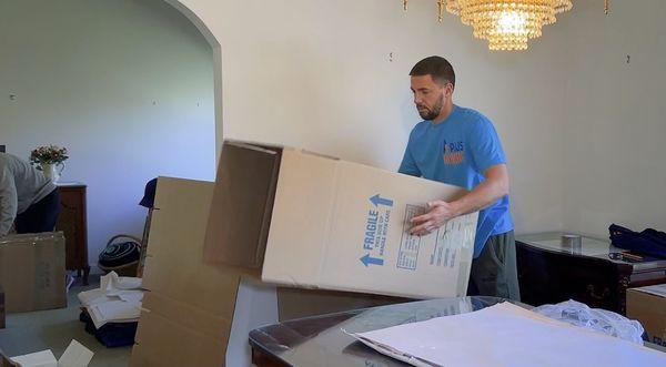 Careful packing of china and fragile items.