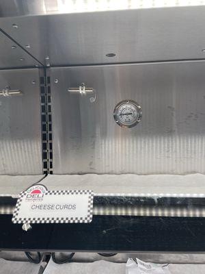 Thermometer in hot food display reading 105 degrees.