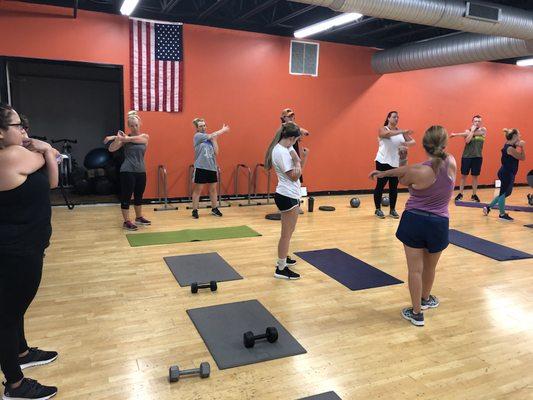 Head trainer Erin Marcum getting everyone stretched out and ready to kill a workout!