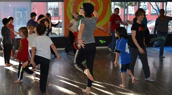 Students, teachers and students play movement games together at our 2016 Share the Love Community Event.