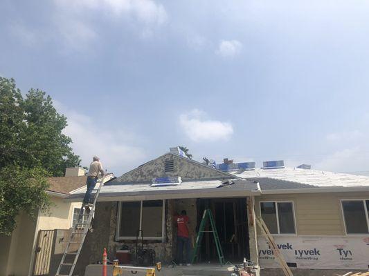 Mark on ladder checking the job site.