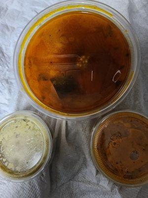 Sambar and chutneys that come with dosa.