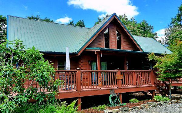 Stained cabin with semi- transparent stain.