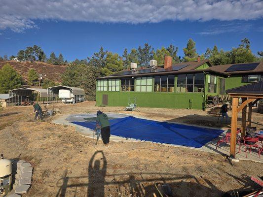 Pavers installation around the pool