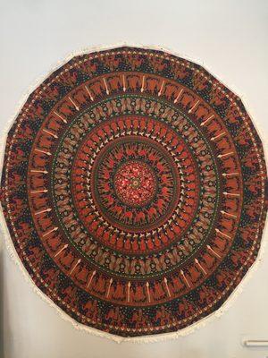 One of our beautiful round tapestries. We also carry traditional sqaure shape, in many designs and colors
