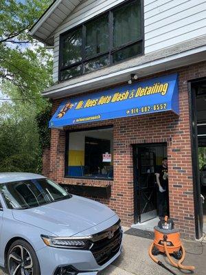 Front of wash. You pull in from the back.