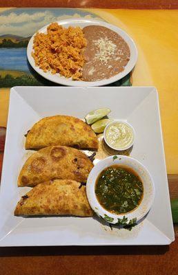 Birria Tacos with side of Rice and Beans