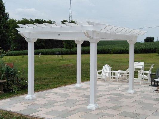 Vinyl Artisan Pergola is a nice modern and maintenance free addition to your backyard project. Custom built to fit!