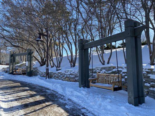 Swing benches along path