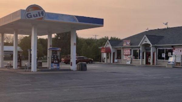 Gulf gas pump area plus there mini mart store behind them.