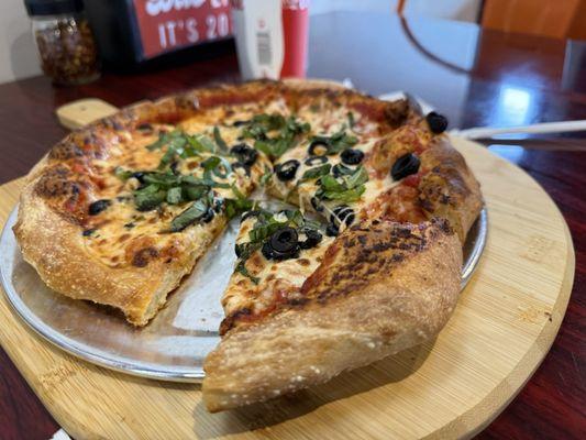 Black olive and basil pizza