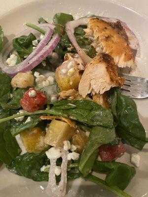 Under the salmon in the salad, yummy!