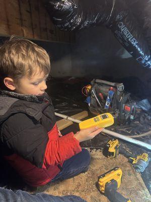 Helping check for CO in the crawl space