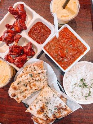 Chicken pop, butter chicken, garlic naan and mango lassis