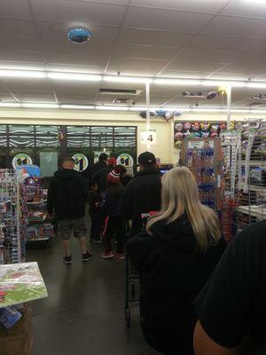 At the DollarTree with a line of over 20 customers, one cashier and three employees hiding on the office. Business as usual!