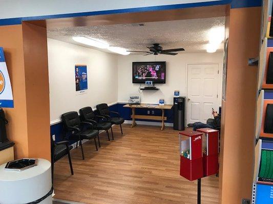 Clean inviting waiting room with complimentary water and coffee.