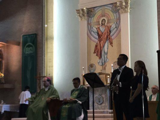 Fr. Tat sitting next to Bishop Duca