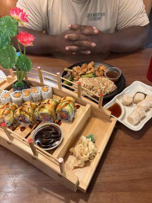 Grenada Roll, eel sauce/ spicy salmon roll. shrimp shumai, steak and chicken hibachi with rice