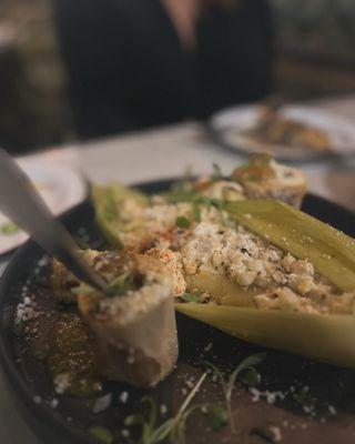 BONE MARROW ESQUITE Street Style Corn. Arbol Aioli. Dried Hot Sauce. Swect Com Tamale. Salsa Verde