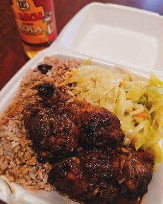 Delicious brown chicken, cabbage, beans and rice