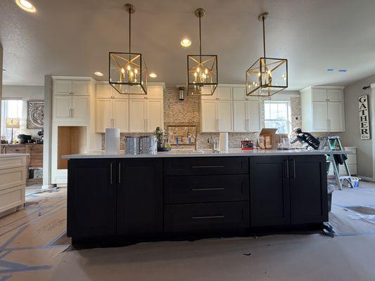 Installed kitchen island
Installed pendant lights
Installed backsplash