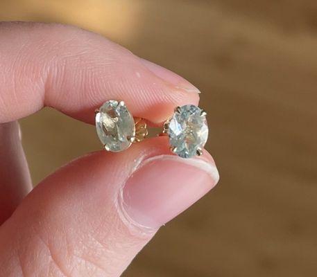 Custom Aquamarine oval studs in gold jackets.