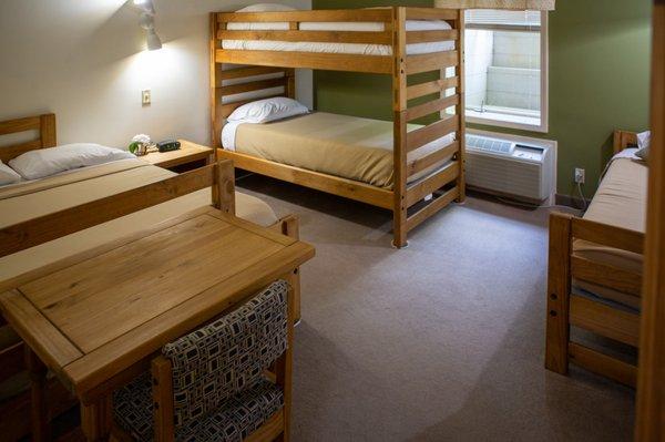 We have 22 Lodge rooms - each holding one double, one single & one bunkbed and a bathroom. Individuals or groups can stay here!