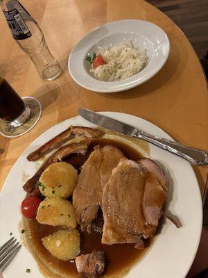 Crispy roast pork with potato dumplings and sauerkraut. Pork was tender and juicy and its skin was crispy!