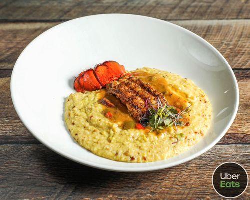 Jalapeño bacon cheese grits featured with coke water lobster tail