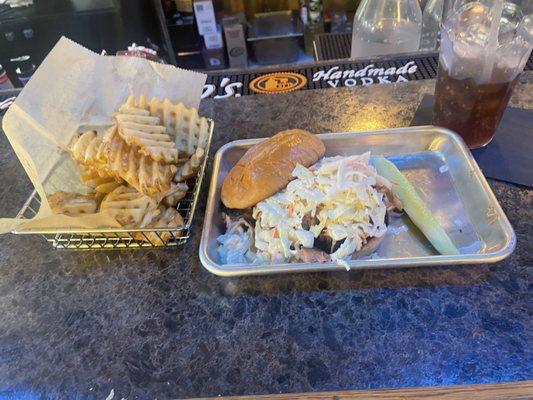 Pulled pork sandwich, and waffle fries.