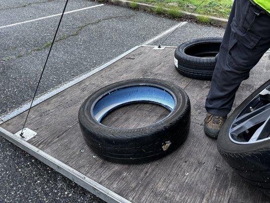 Damaged tire filled with temporary sealant