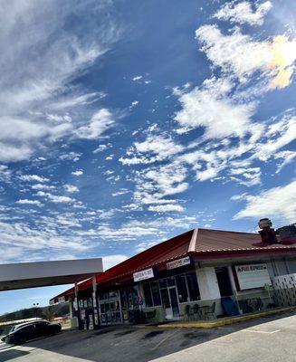 Small station with about 5 spots with big rig parking and a taco joint