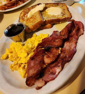 French toast, scrambled eggs, & bacon.