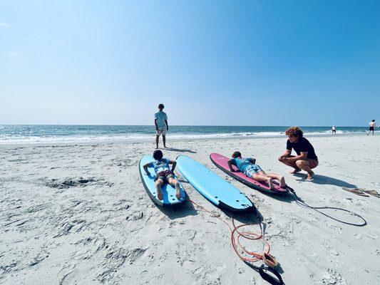 Teaching surf fundamentals before catching waves.