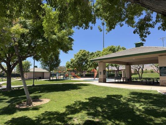 Shaded area for picnics and parties with the playground in the background.