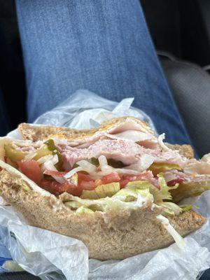 Half eaten sandwich, ham/turkey and all the fixins! Made fresh while you wait.