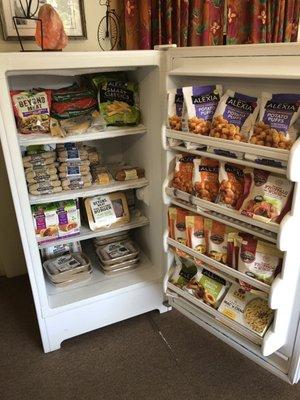 Vegan faux meats- Beyond Meat burgers and sausages, Field Roast, and another freezer of Gardein.