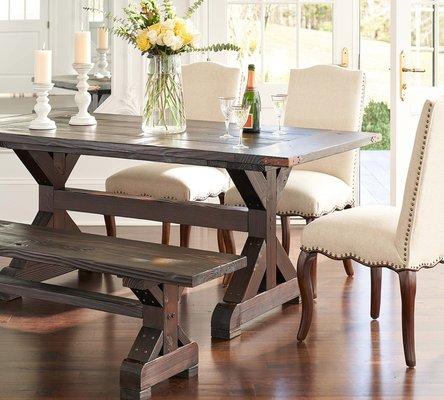 The Carmody Table features a sturdy planked top and trestle legs, and provides comfortable seating for six.