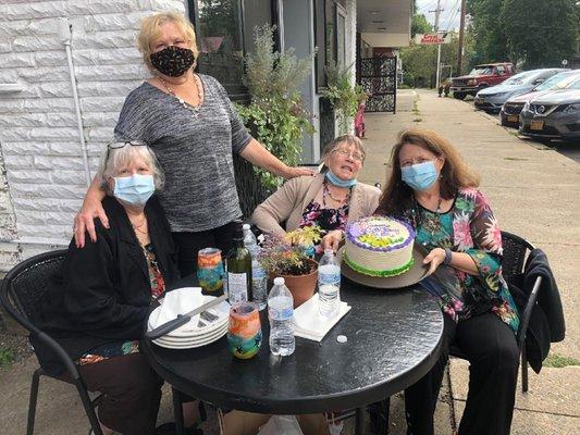 Birthday girl Afton Cafe with beautiful and delicious carrot cake