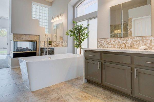 Stunning Primary Bath situated near the 3 way fireplace ideal for a relaxing environment.