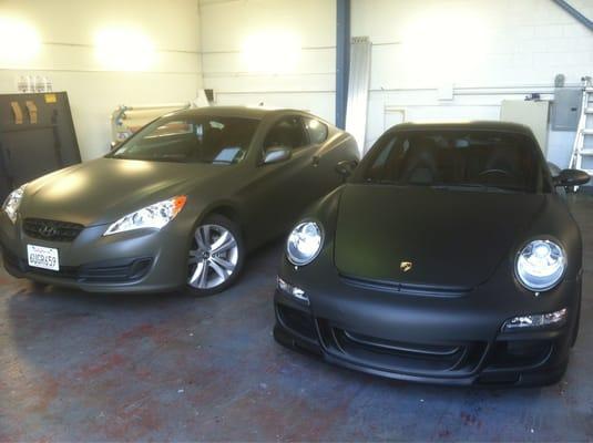 My Genesis Coupe on the left in matte military green; Porsche on the right in matte black.